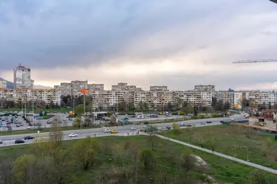 a view of a city with a highway and buildings at My Place in Sofia
