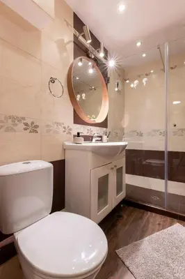 a bathroom with a toilet and a sink and a mirror at My Place in Sofia