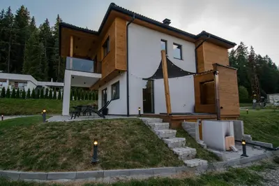 a house is being built with a yard at Hyggemate - Nordic Villa with Sauna & Jacuzzi Retreat in Sarnitsa