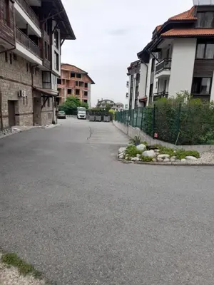 an empty street next to some buildings at Lux apartment 223 in Bansko