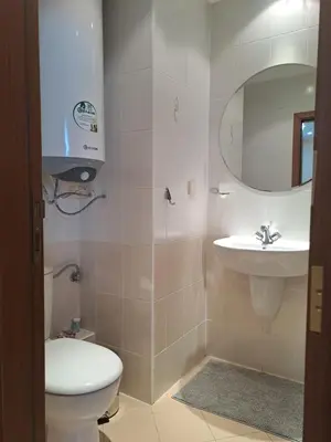 a bathroom with a toilet and a sink at Family Studio 407, Villa park in Borovets