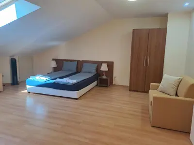 a large bedroom with a bed and a couch at Family Studio 407, Villa park in Borovets