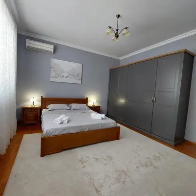 a bedroom with a bed and a large cabinet at La Casa di Sofia in Sofia