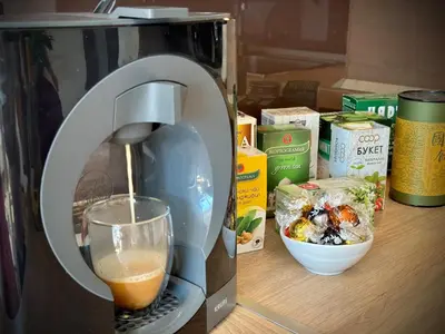 a coffee maker with a glass of wine on a counter at Sunny & Comfort Apartment next to Tech Park for 4 Guests in Sofia