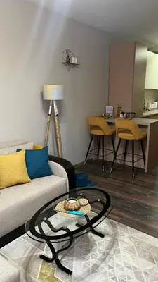 a living room with a couch and a table at John Apartment 2 in Blagoevgrad