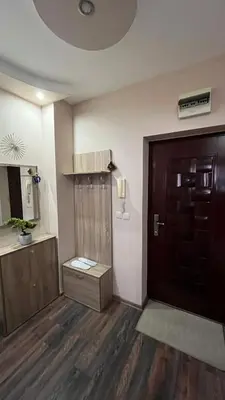 a room with a door and a wooden floor at John Apartment 2 in Blagoevgrad