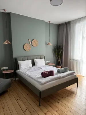 a bedroom with a large bed with white sheets at Sofia Vibes - Friends & Family Stay in Sofia