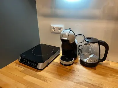 a coffee maker and a tea kettle on a table at Sofia Vibes - Friends & Family Stay in Sofia