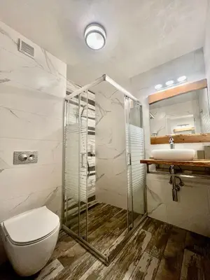 a bathroom with a toilet and a sink at Китанова къща in Koprivshtitsa