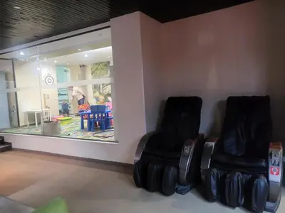 two black chairs sitting in a room with a mirror at Апартамент А101 хотел Снежанка in Pamporovo