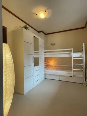 a bedroom with two bunk beds in a room at Wonderful ski resort apartment in Bansko