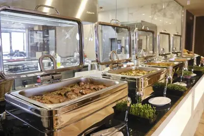 a buffet line with many different types of food in sinks at Wonderful ski resort apartment in Bansko