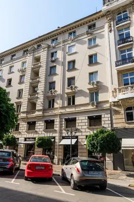 two cars parked in a parking lot in front of a building at Presidential neighbour retreat in Sofia