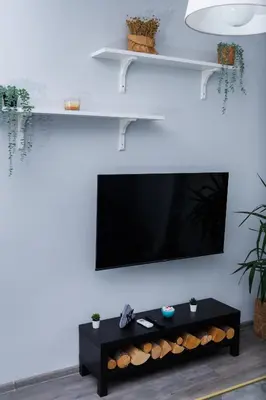 a living room with a tv on a wall at Presidential neighbour retreat in Sofia