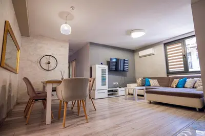 a living room with a couch and a table at ДиНати in Plovdiv