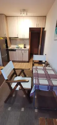 a kitchen with two chairs and a table at Blue sea in Sofia