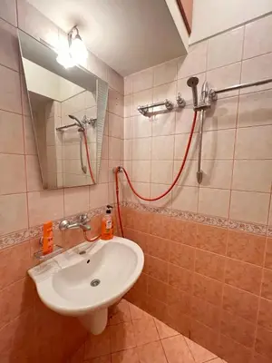 a bathroom with a sink and a shower at Mumbai Spacious 150 Sq M 2BDR near Vitosha BLVD and NDK in Sofia
