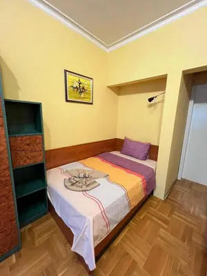 a bedroom with a bed with a plate on it at Mumbai Spacious 150 Sq M 2BDR near Vitosha BLVD and NDK in Sofia