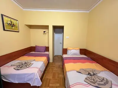 a room with two beds with towels on them at Mumbai Spacious 150 Sq M 2BDR near Vitosha BLVD and NDK in Sofia