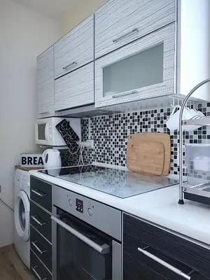 a kitchen with a sink and a stove top oven at apartment Serenity, Bansko in Bansko