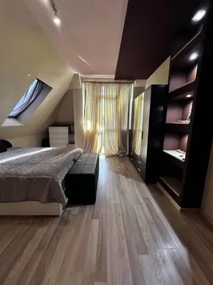 a bedroom with a bed and a large window at кристален въздух in Sofia