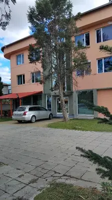 a car parked in front of a building at Интернационал in Kulata