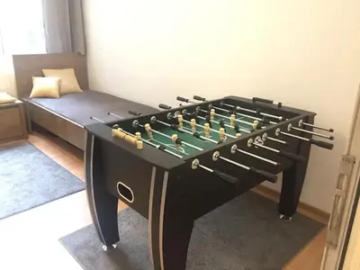 a table with a chess board on top of it at Stay and Play - Foosball and Comfort in Sofia