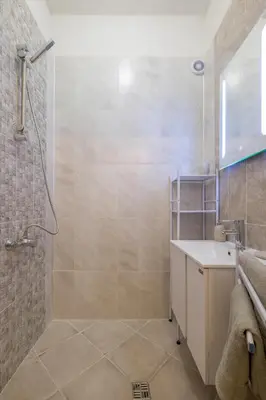 a bathroom with a shower and a sink at Stay and Play - Foosball and Comfort in Sofia