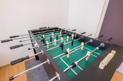 a group of people on a bowling alley at Stay and Play - Foosball and Comfort in Sofia
