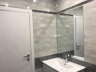 a bathroom with a sink and a mirror at Predela 1 Bansko Apartment in Bansko