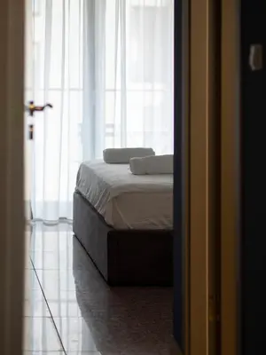 a bed with two pillows on it in a room at Vertigo 2 Modern 2-Bedroom Apartment with Parking & Vitosha View in Sofia