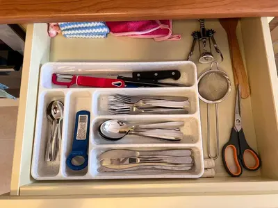 a drawer filled with utensils in a drawer at Apartment Saint Ivan Ski Resort in Bansko
