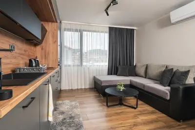 a living room with a couch and a table at City Apartments 4 in Velingrad