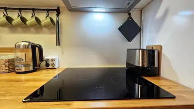a kitchen with a microwave and a coffee maker at Cozy Boho small apartment in Sofia