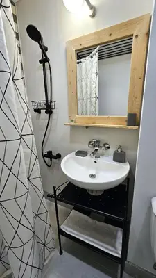 a bathroom with a sink and a mirror at Cozy Boho small apartment in Sofia