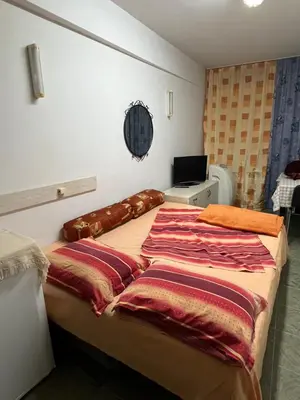 a bedroom with a bed with blankets on it at Cheep&Free on the Ground floor and Pets friendly in Sofia