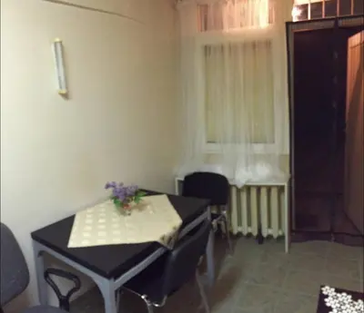 a small room with a table and a window at Cheep&Free on the Ground floor and Pets friendly in Sofia