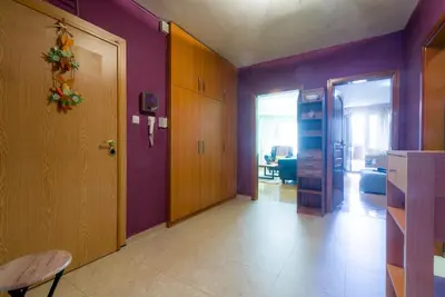 a living room with purple walls and a door at Sofia Centre with Free on-site Parking in Sofia
