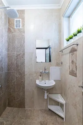 a bathroom with a sink and a shower at Black Peak Panorama central apartment in Sofia