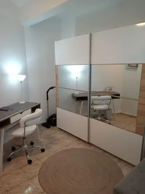 an office with a desk and two chairs and a mirror at Cathedral Central Apartment Top Location in Sofia