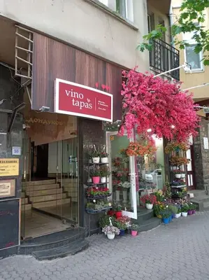 a store with a sign on the side of a building at Cathedral Central Apartment Top Location in Sofia