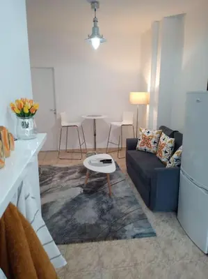 a living room with a couch and a table at Cathedral Central Apartment Top Location in Sofia