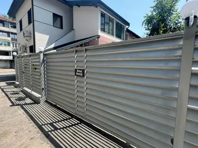 a metal fence in front of a house at Luxurious House with Deluxe rooms & Free Secured Parking in Sofia
