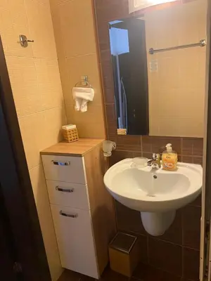 a bathroom with a sink and a mirror at Bansko Royal Towers APARTMENT 738 in Bansko