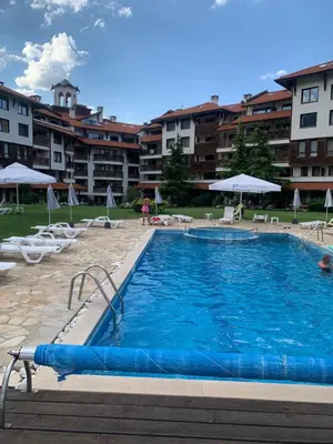 a large swimming pool in front of a building at Bansko Royal Towers APARTMENT 738 in Bansko