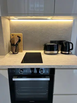 a kitchen counter top with a stove and appliances at Elements Stylish Central 1BDR w High Speed WiFi and Work Space in Sofia