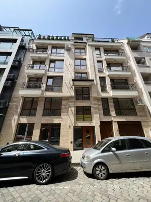 two cars parked in front of a building at Elements Stylish Central 1BDR w High Speed WiFi and Work Space in Sofia