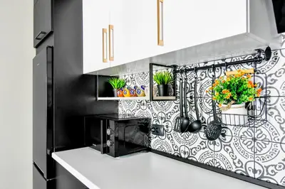 a kitchen with a black and white patterned wall at Prime Spot for 5 Full Kitchen Wi-Fi AC in Sofia
