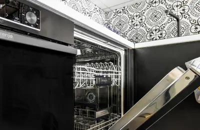 an open dishwasher in a kitchen with at Prime Spot for 5 Full Kitchen Wi-Fi AC in Sofia