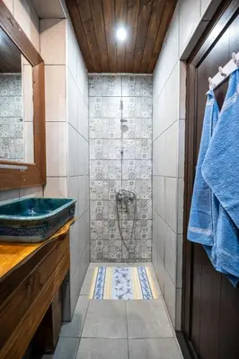 a bathroom with a sink and a shower at Къща за гости Приказка in Klisura